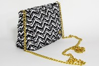 Black and White hand-woven mini purse with chain (Side View)